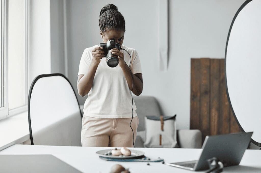 photographer taking product photos based on trending 2024 pinterest topics